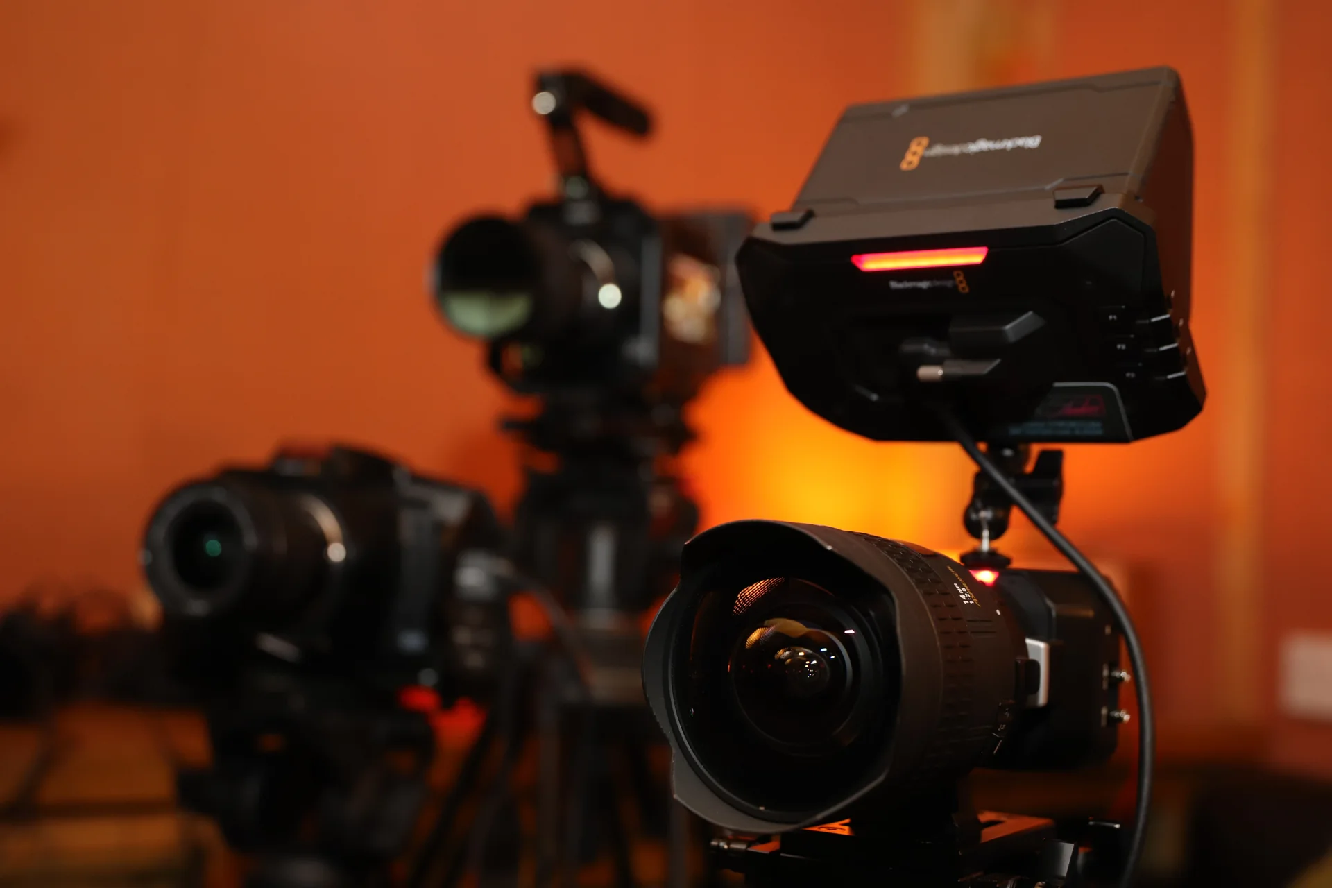 Professional cameras and a camera-mounted monitor set up for live streaming